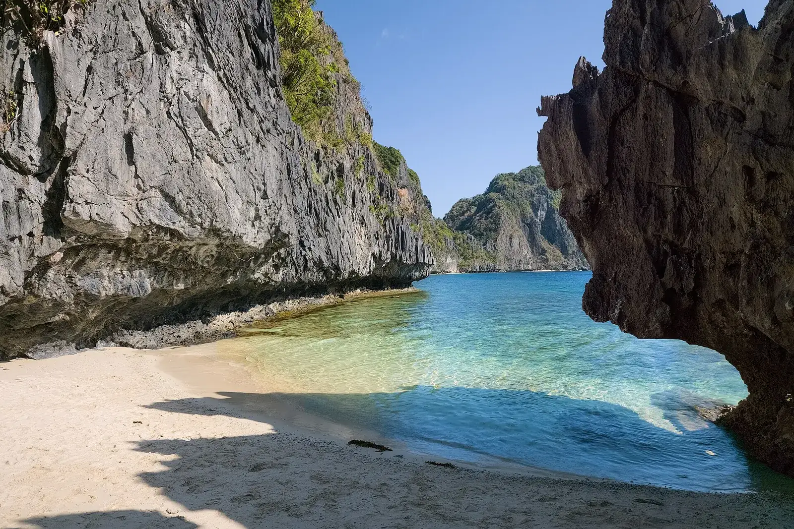 Beach under a limestone arch